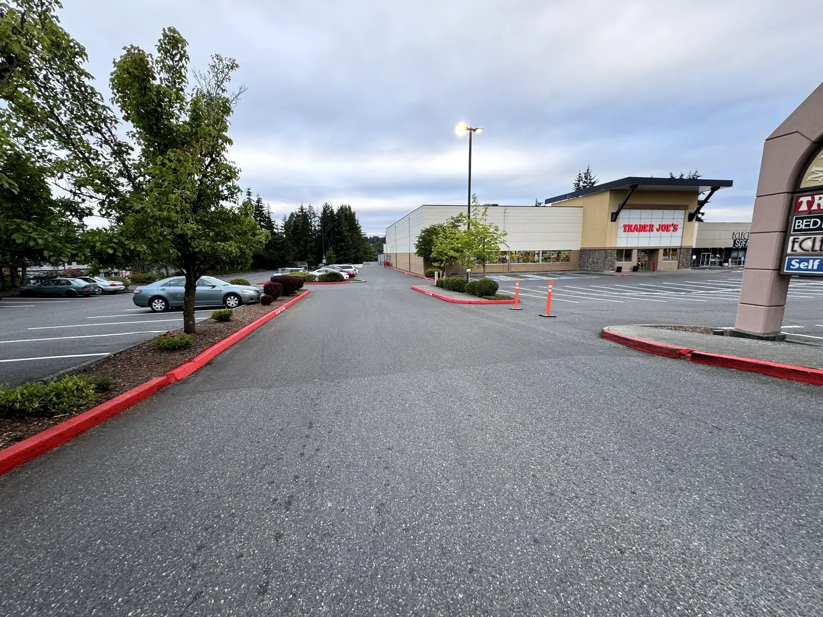Retail center parking lot with fresh striping and red fire lane curbs